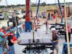 Preparing the wave glider for deployment. Image credit: NOAA