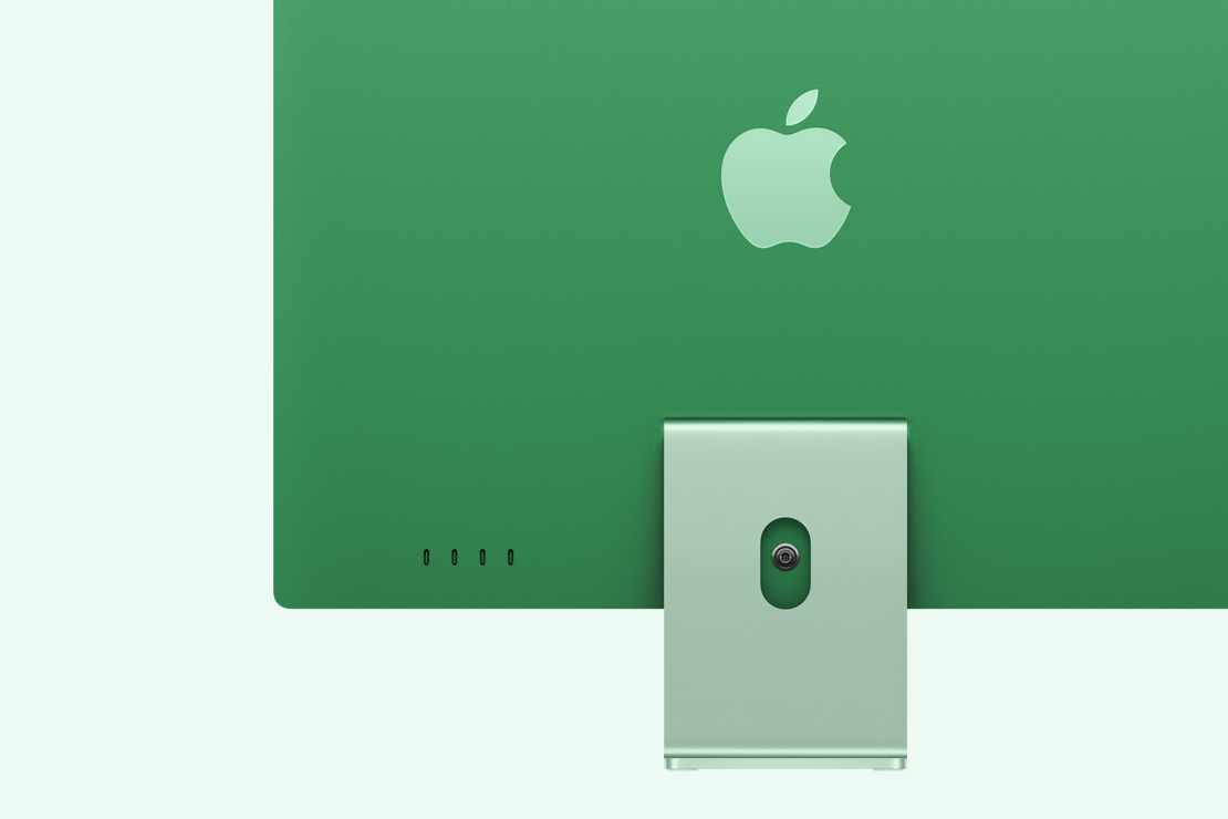 Imagem da parte de trás de um iMac verde, com destaque para as quatro portas USB-C