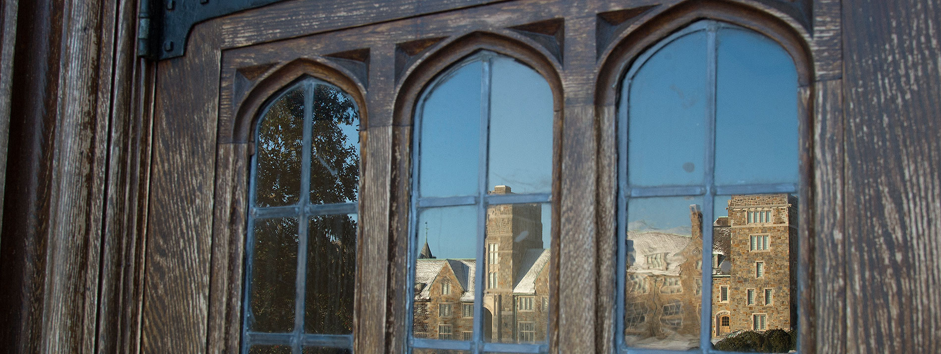 Reflection of the Ford Buildings in curved windows