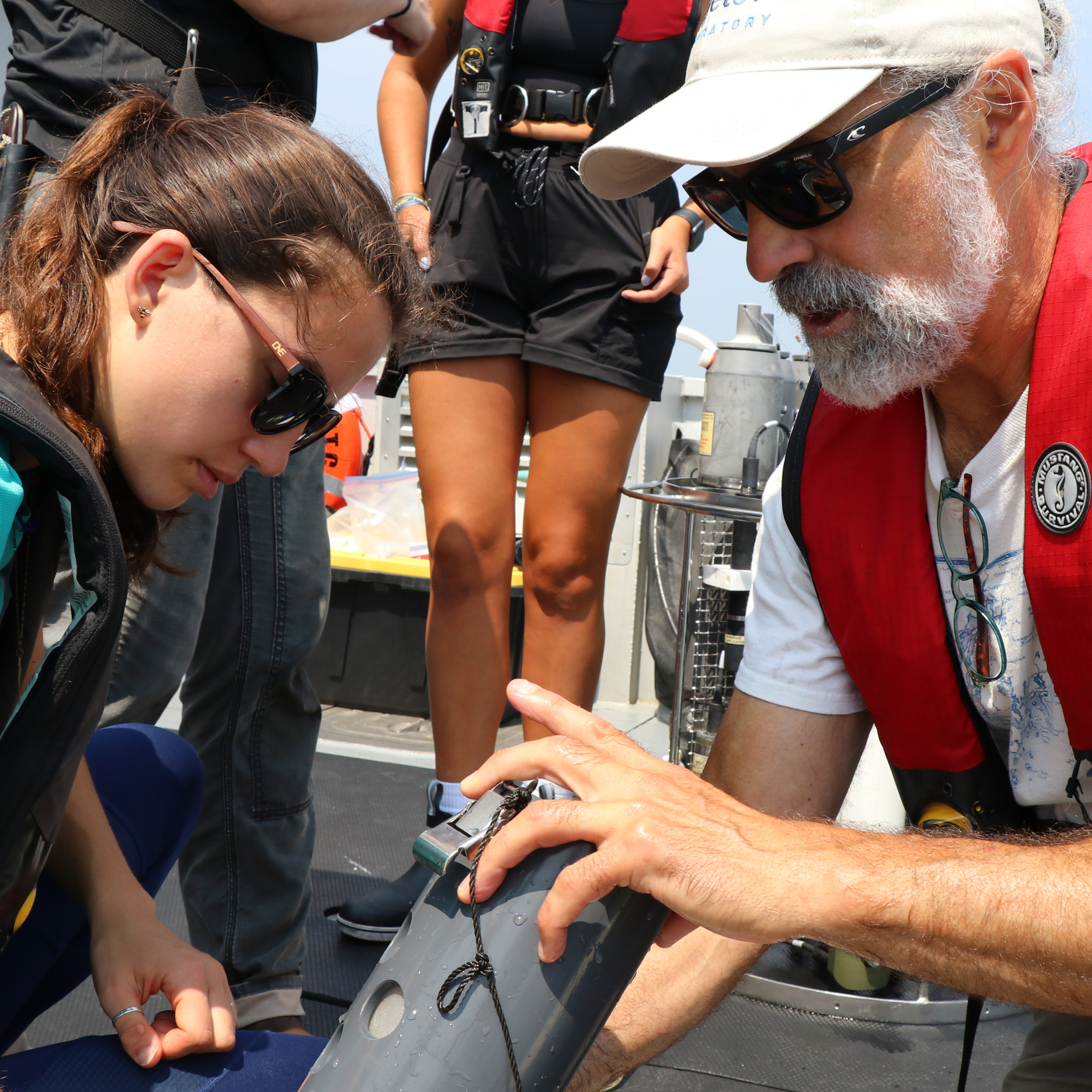 Dave Fields explaining an instrument with a student.