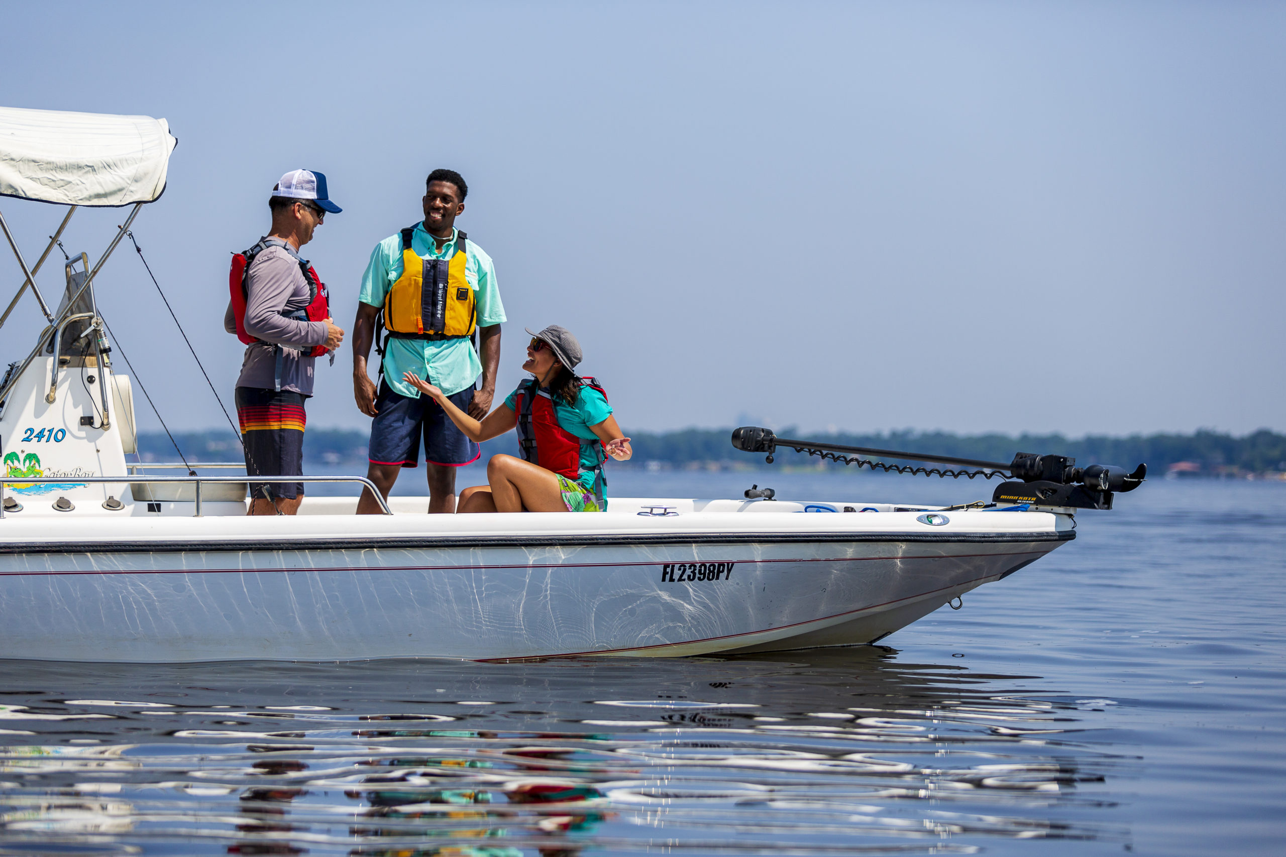 People wearing lifejackets on a boat, boater education concept. 