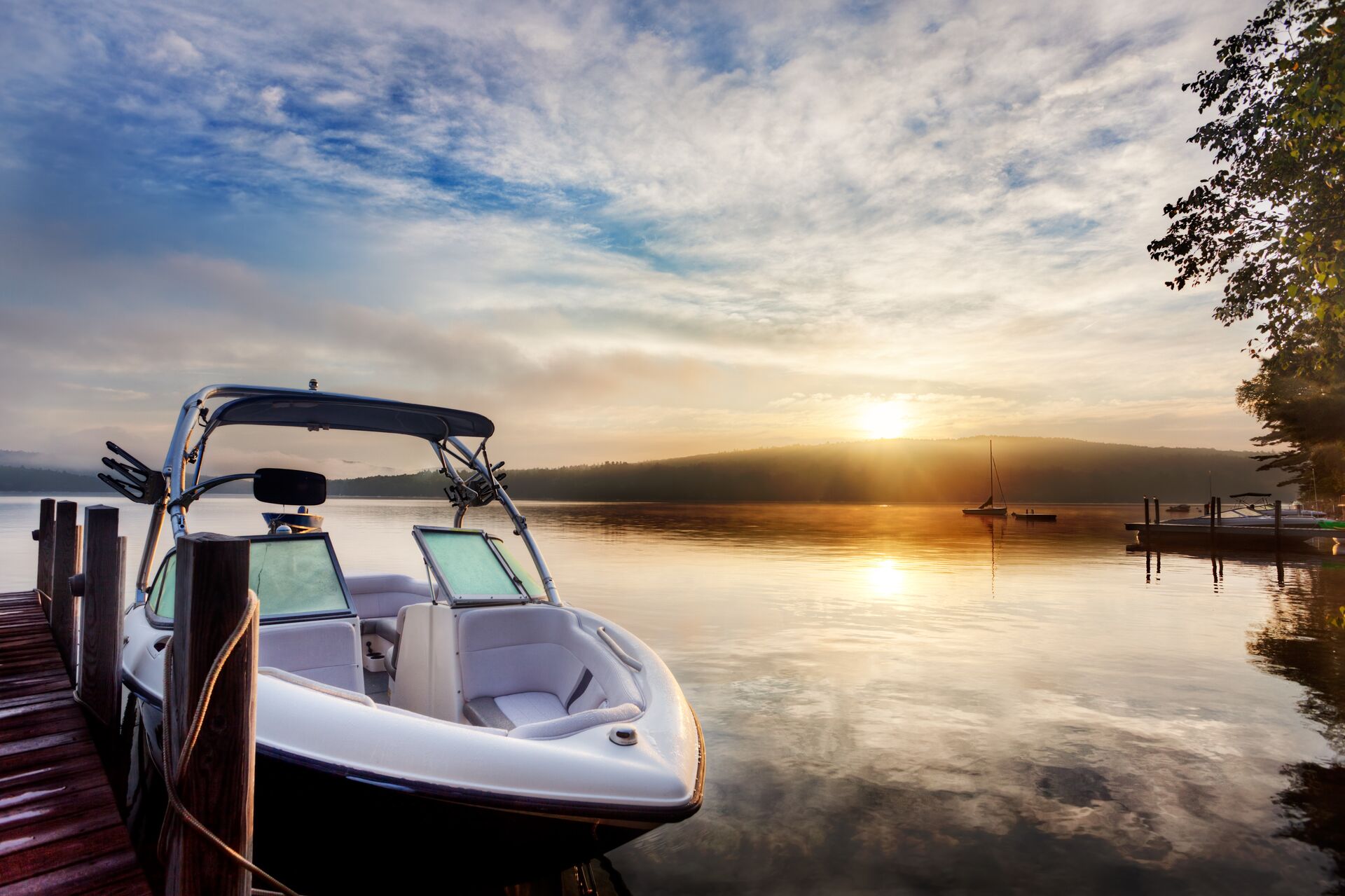 A boat at a dock at sunset, boat rentals near me concept. 