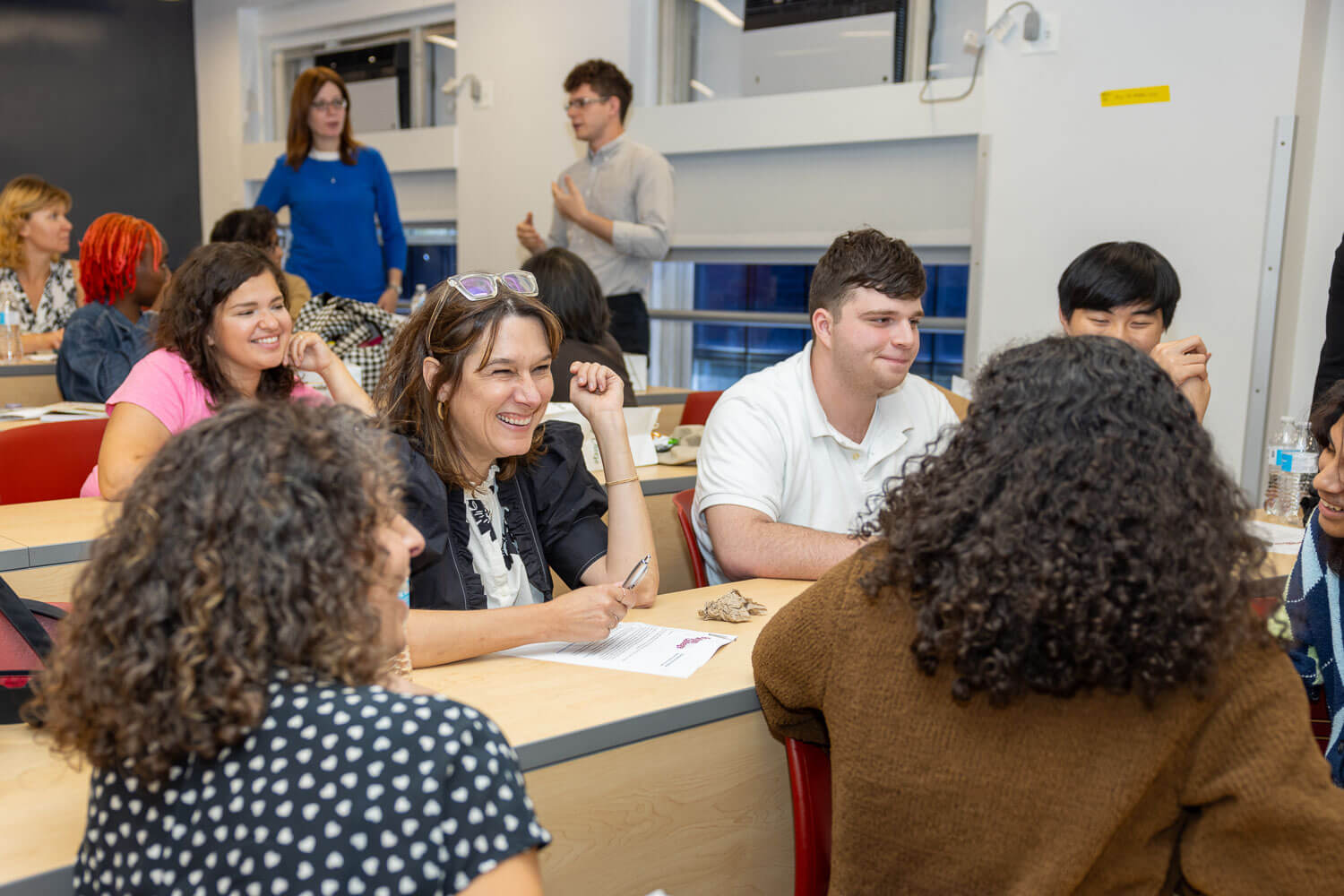 Faculty director of the Tow Mentorship Tammy Lewis meets with students at the kickoff of the Tow Mentorship Initiative.