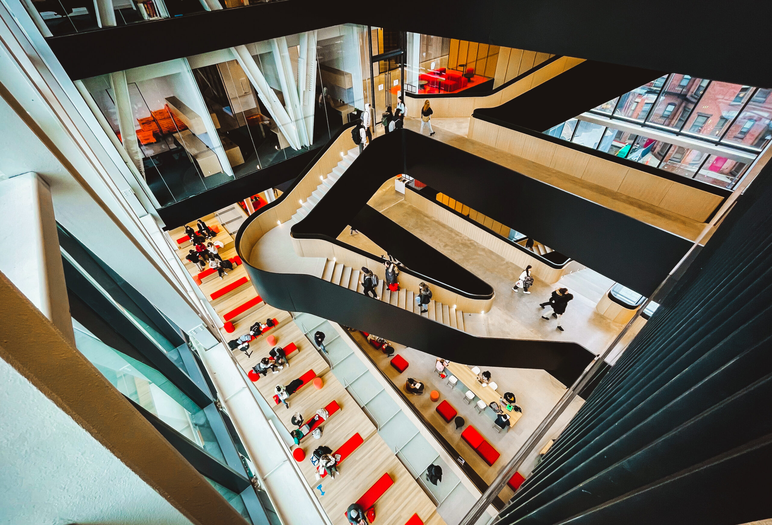 Photo from above of students and the central stairwell of the Boston University Center for Computing & Data Sciences