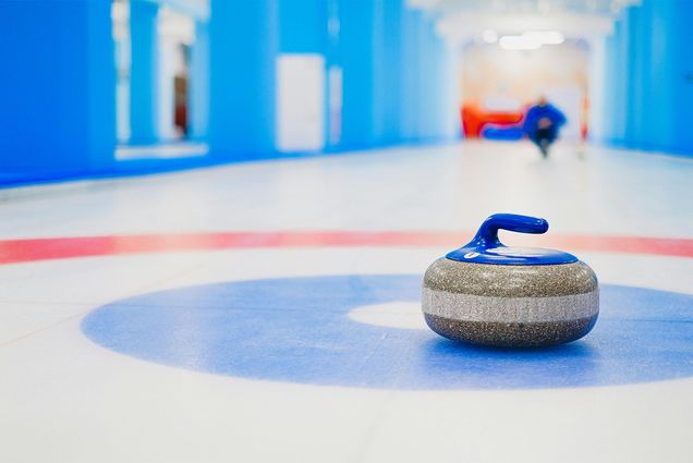 Photo: A curling stone on a sheet of ice