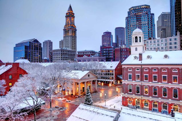 Photo: A view from above Quincy Market, with snow lining the Boston skyline and a Christmas tree outside of the marketplace