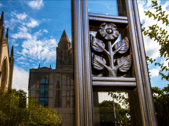 A photo reflection of the Marsh Plaza at Boston University. Learn more about financial aid at BU MET.