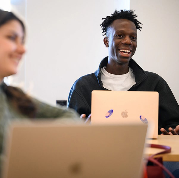 Two Dietrich College graduate students in a classroom