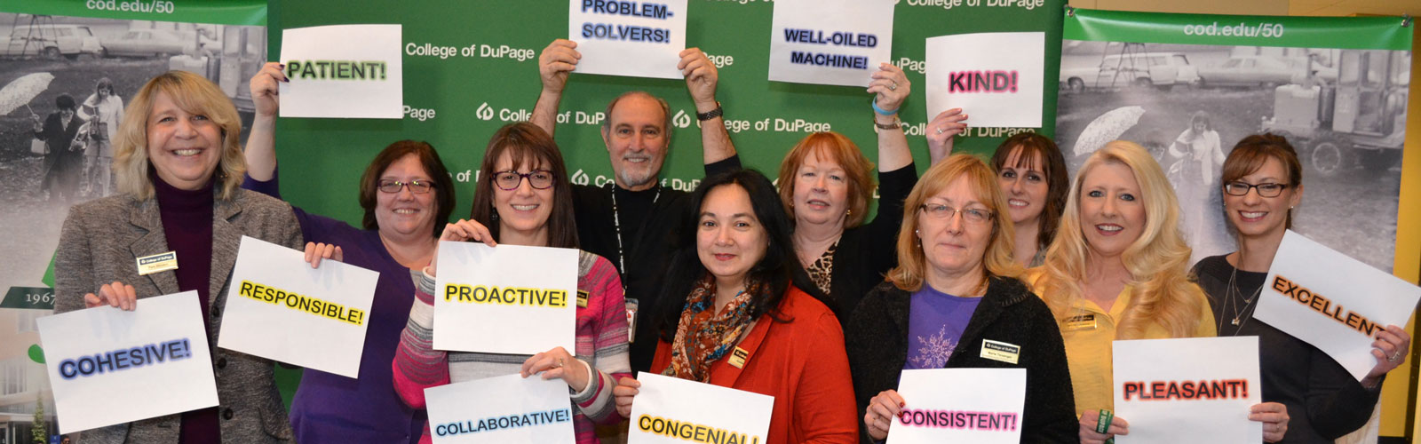 Employees holding signs