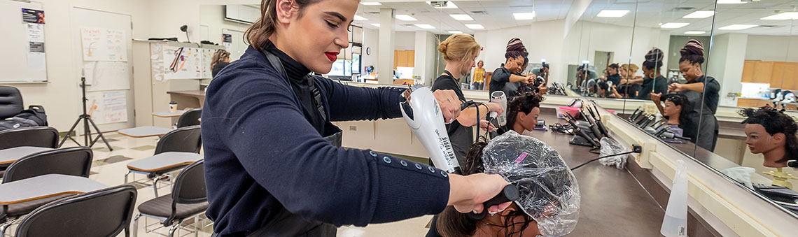 woman working on a models hair