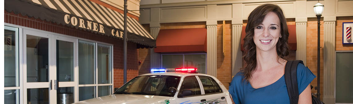 student standing in mock street scene