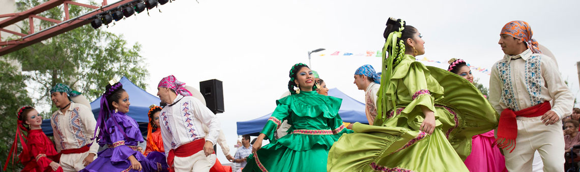 Dancers performing outside on stage