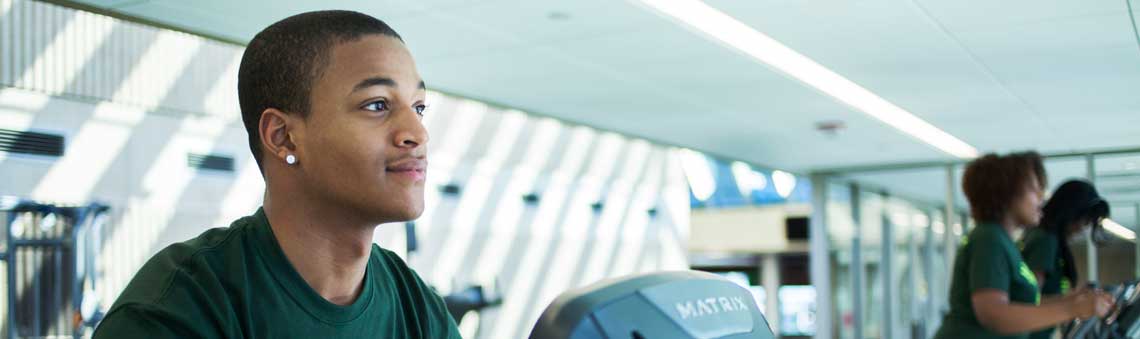 student working out on treadmill