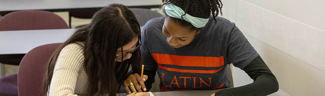 two students working together on classwork