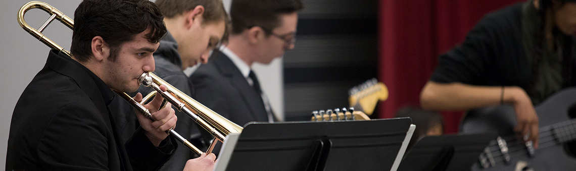 student playing an instrument