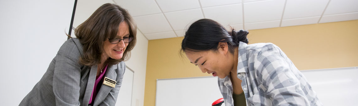 student working with faculty member