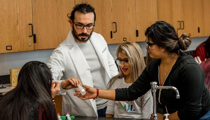 science teacher with female students