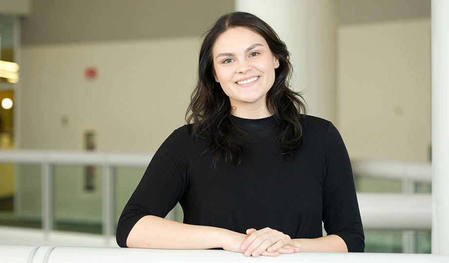 Angelica Rossi standing for photo with arms crossed