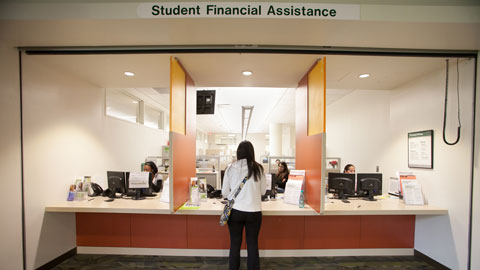 Female student at financial assistance desk