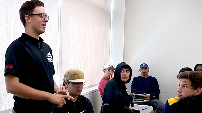 Student giving speech in class