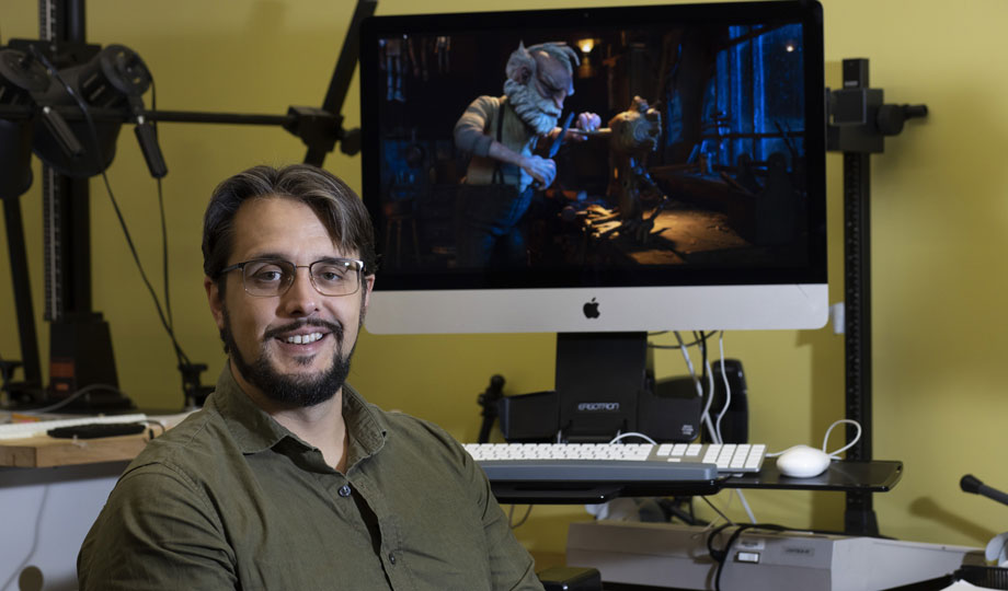 Bob Blevins posing with an animated model