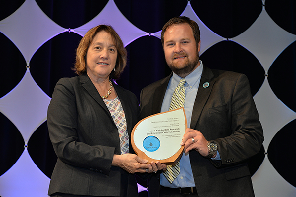 Clint Wolfe accepts Promotional Partner of the Year for Texas A&amp;M AgriLife Research and Extension Center – Dallas.