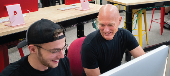 Student working with a professor.