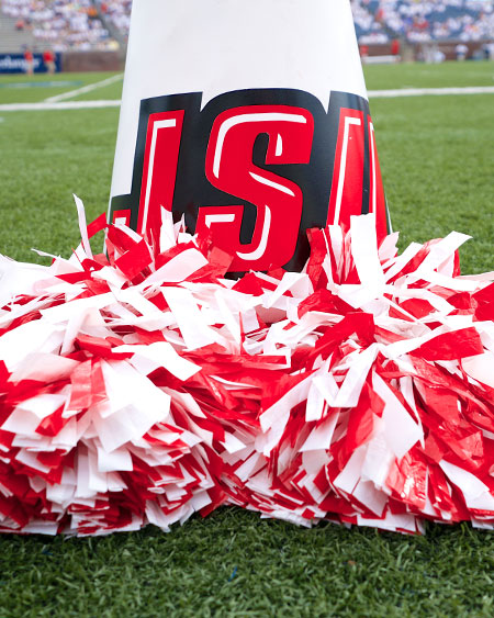 red and white pompoms sit at the base of a JSU megaphone