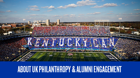 Stadium-goers spelling out the words "Kentucky Can"