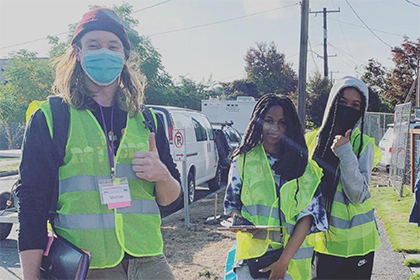 volunteers on a neighborhood sidewalk 