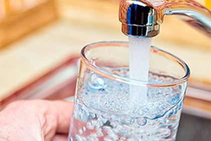 Tap water poured into glass 