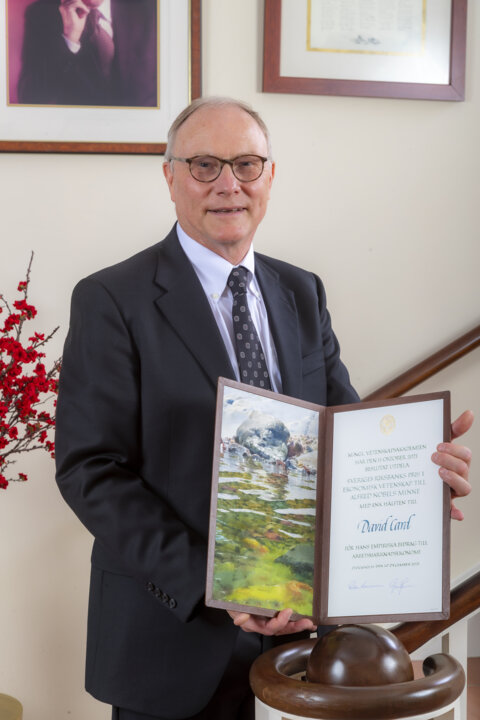 David Card showing his diploma.