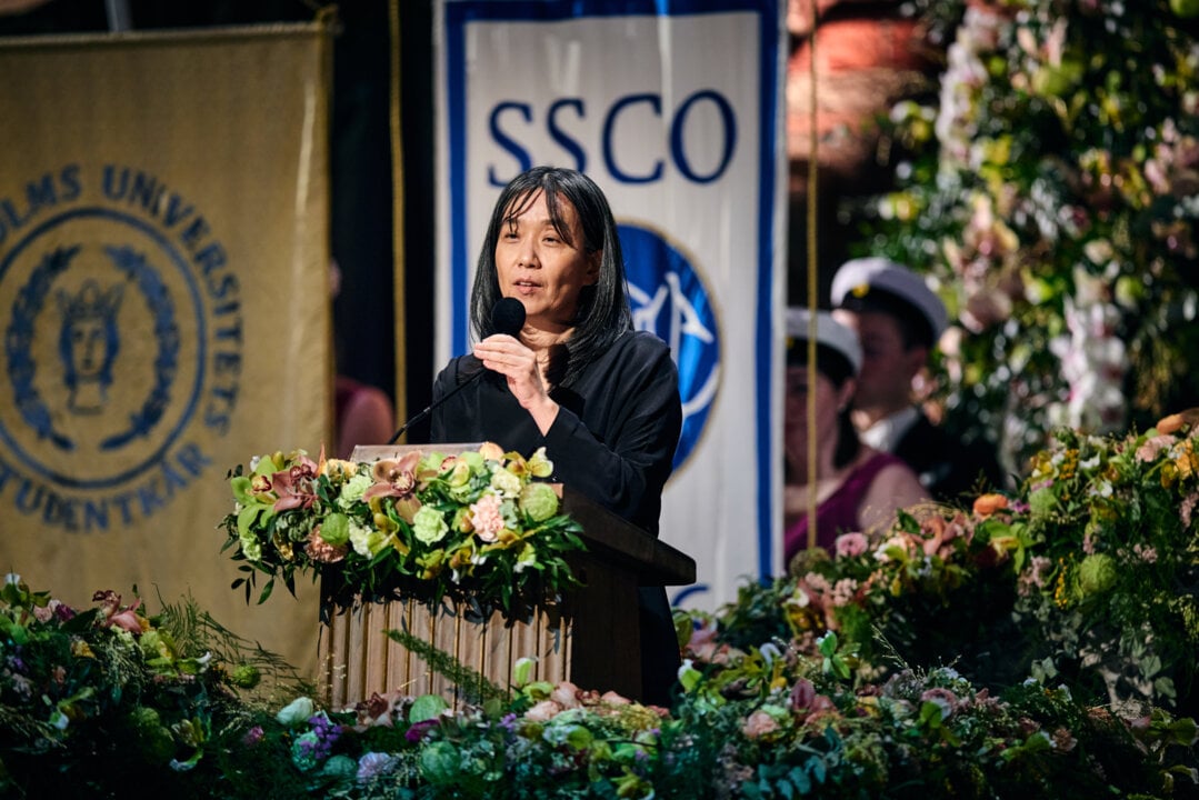 A woman speaking in a lectern