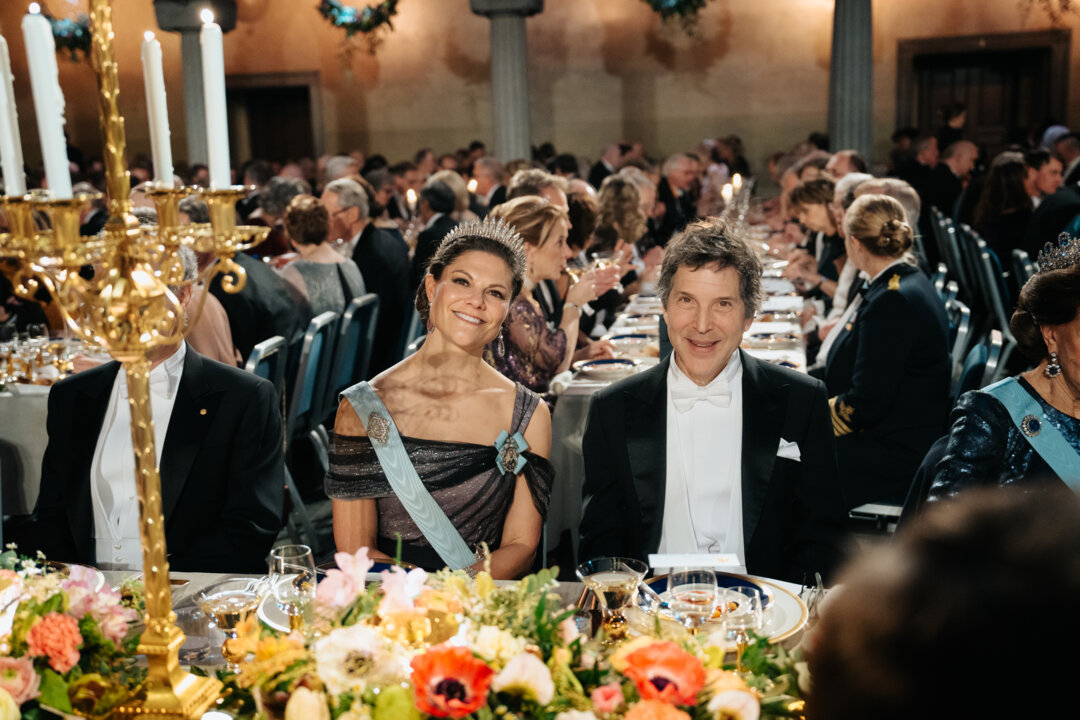 A woman and a man sitting at a festive table