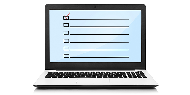 laptop with check box on screen on white background