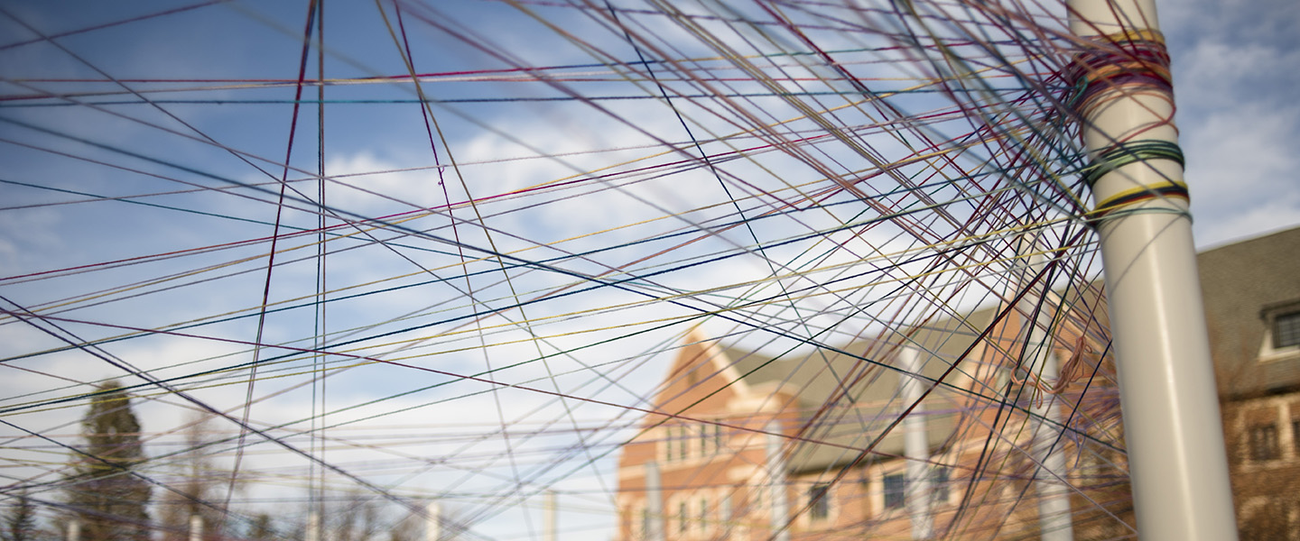 art installation of criss crossed strings