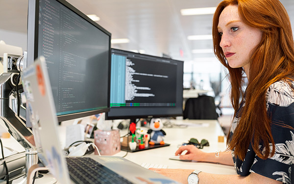 software engineer coding at desk