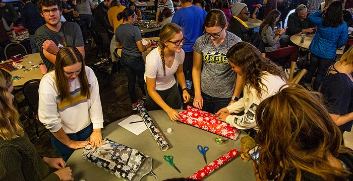 students wrapping presents