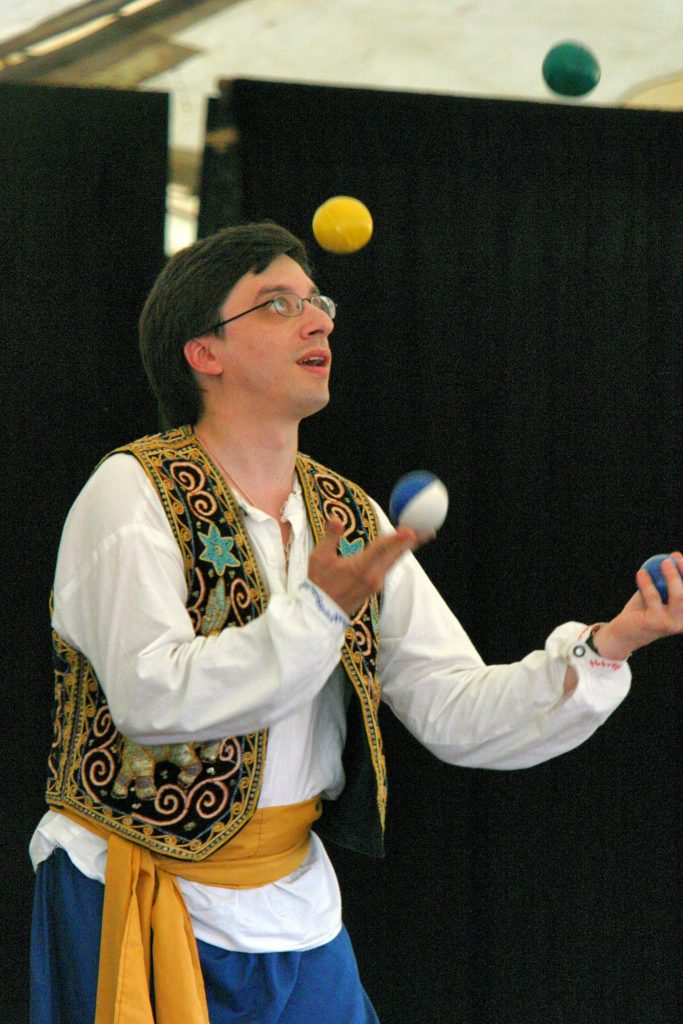 A juggler mid-toss