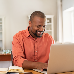 man on a laptop at desk