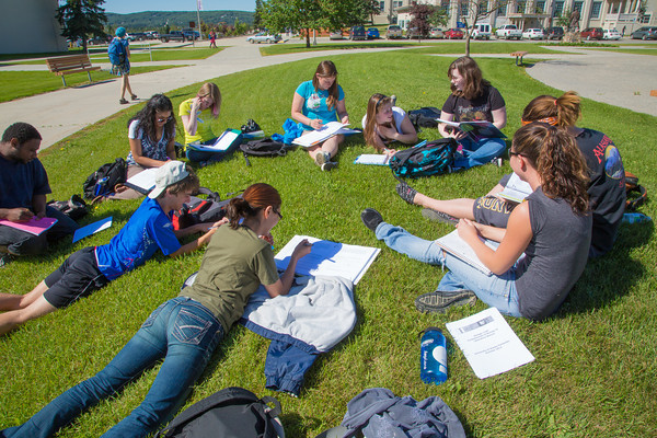 UAF students attend a summer class outdoors on the Fairbanks campus