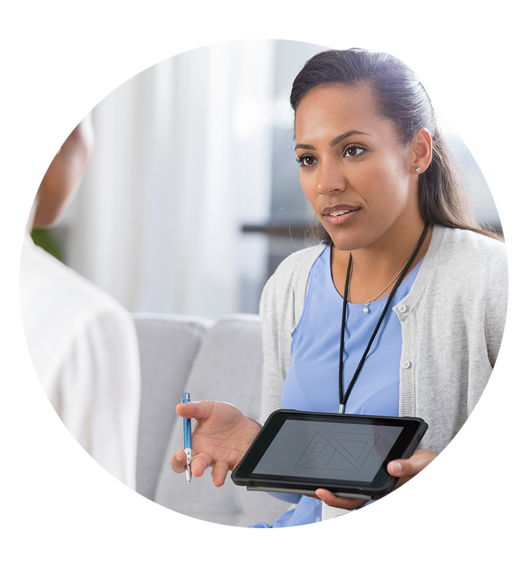 Woman holding tablet talking to patient