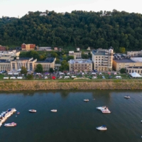 drone view of symphony sunday event on the riverbank lawn