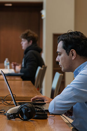 a student at their laptop in the Student Union