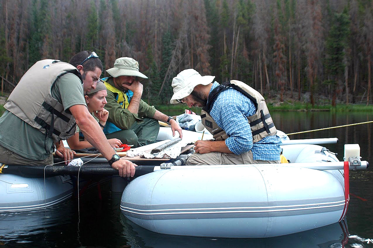 Philip Higuera, UM professor of fire ecology, and his team examine a lake-sediment core from Chickaree Lake in Colorado’s Rocky Mountain National Park. 