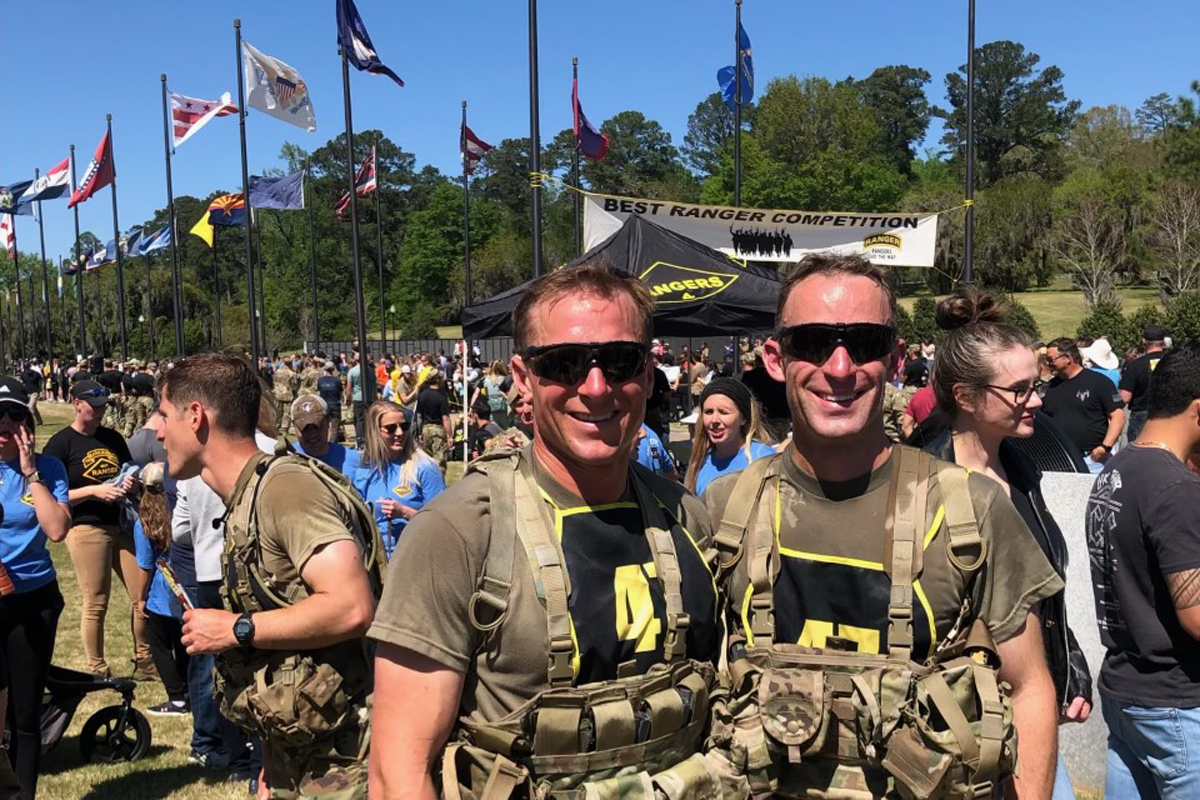 Teammates Michael Blanchard and Brian Slamkowski package a prop body during a training exercise. 