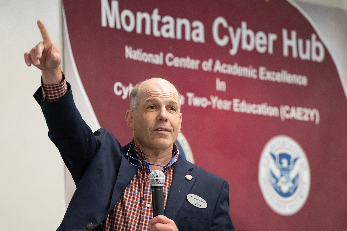 Missoula College Dean Tom Gallagher points to a room full of people