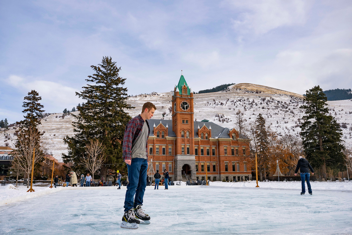 Students skate on the Oval in front of Main Hall