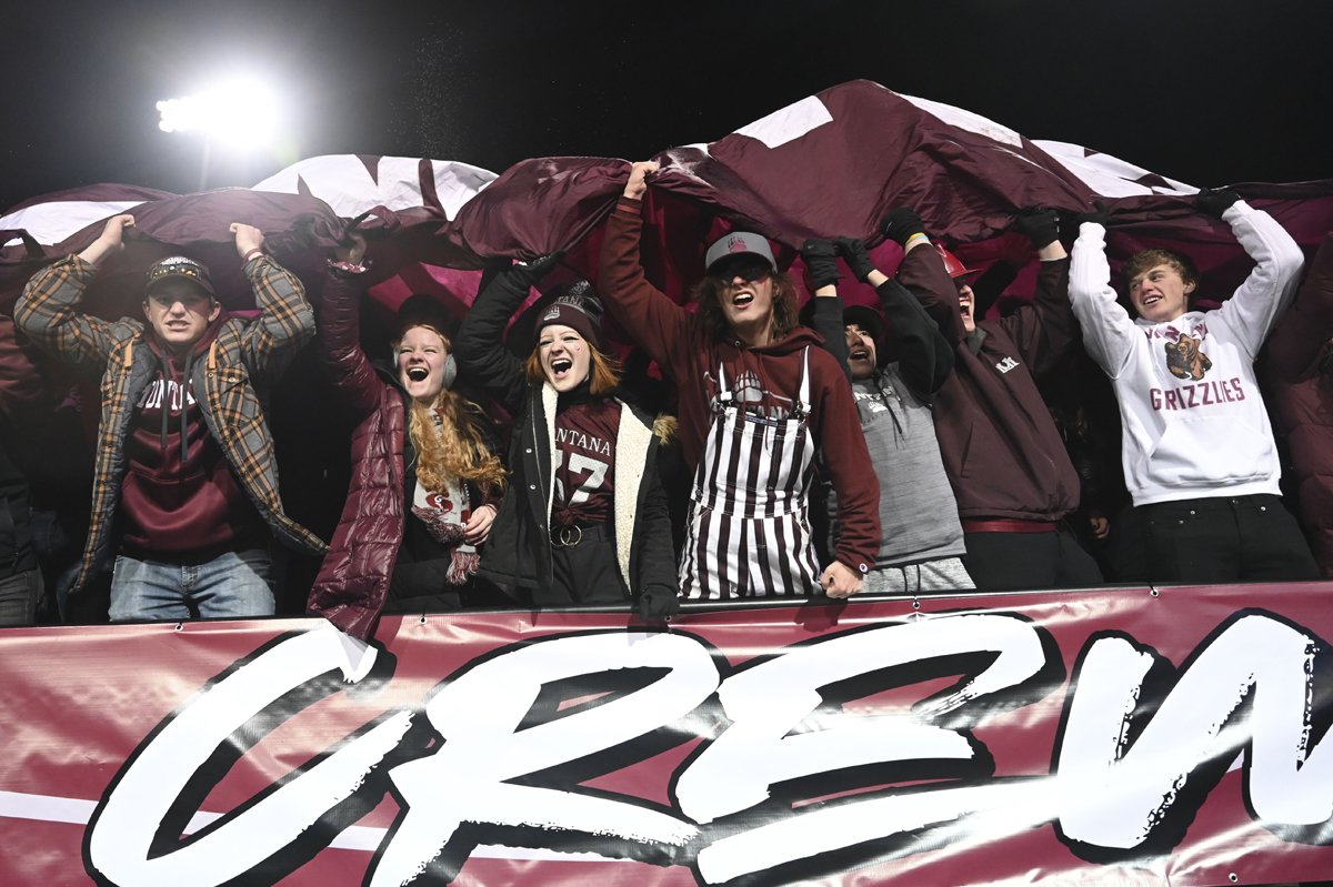 Zoo Crew members cheer at a Griz football game.