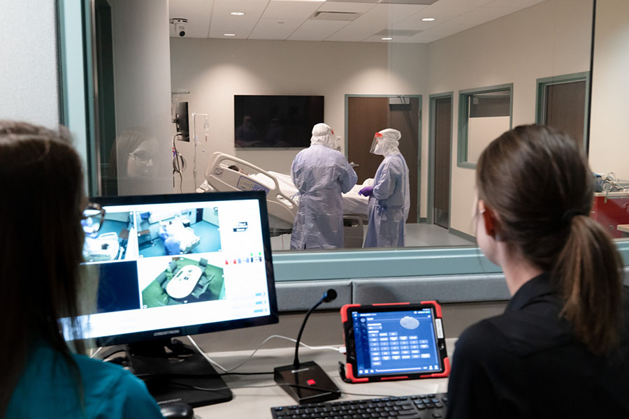 Students train in PPE in simulated biocontainment unit